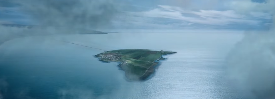 A small, lush island surrounded by a vast expanse of ocean is visible through the gaps in the clouds.